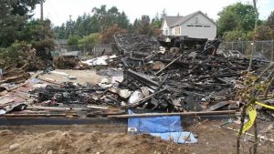 A charred pile of rubble is about all that remained Tuesday in Seattle's Pinehurst neighborhood after a natural-gas explosion leveled the house 